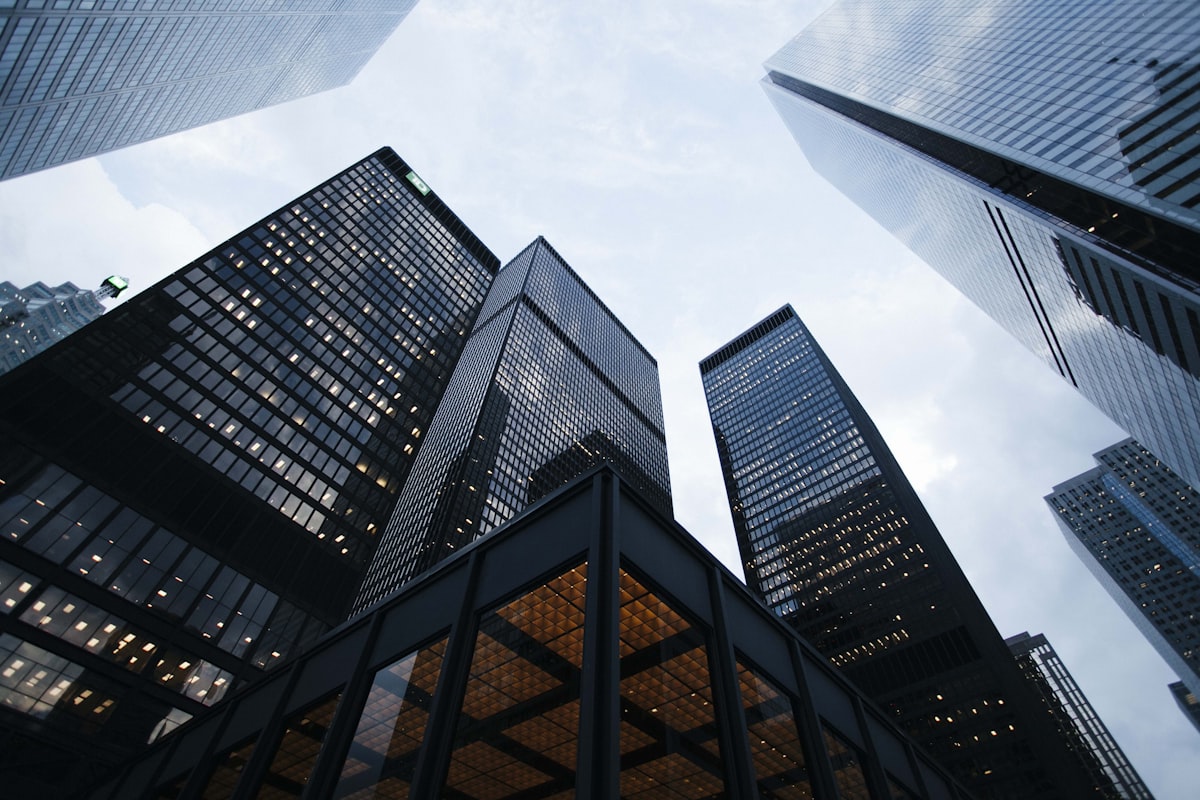 Glass commercial office towers viewed from street level