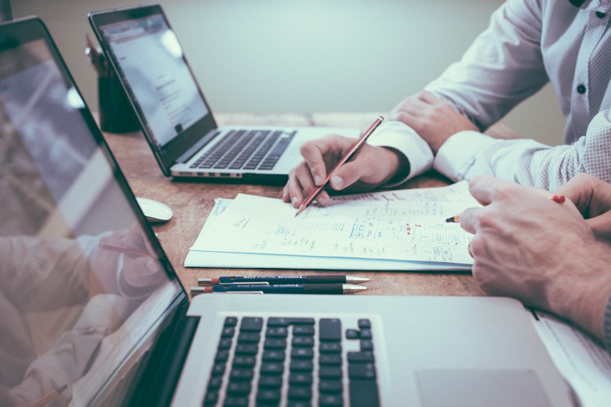Two appraisers reviewing market data and property figures