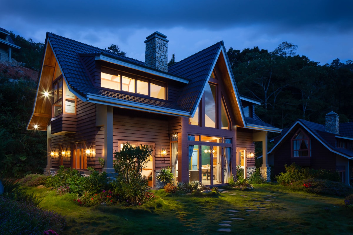 Modern residential home illuminated at dusk